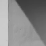 a black and white photo of a person on a skateboard