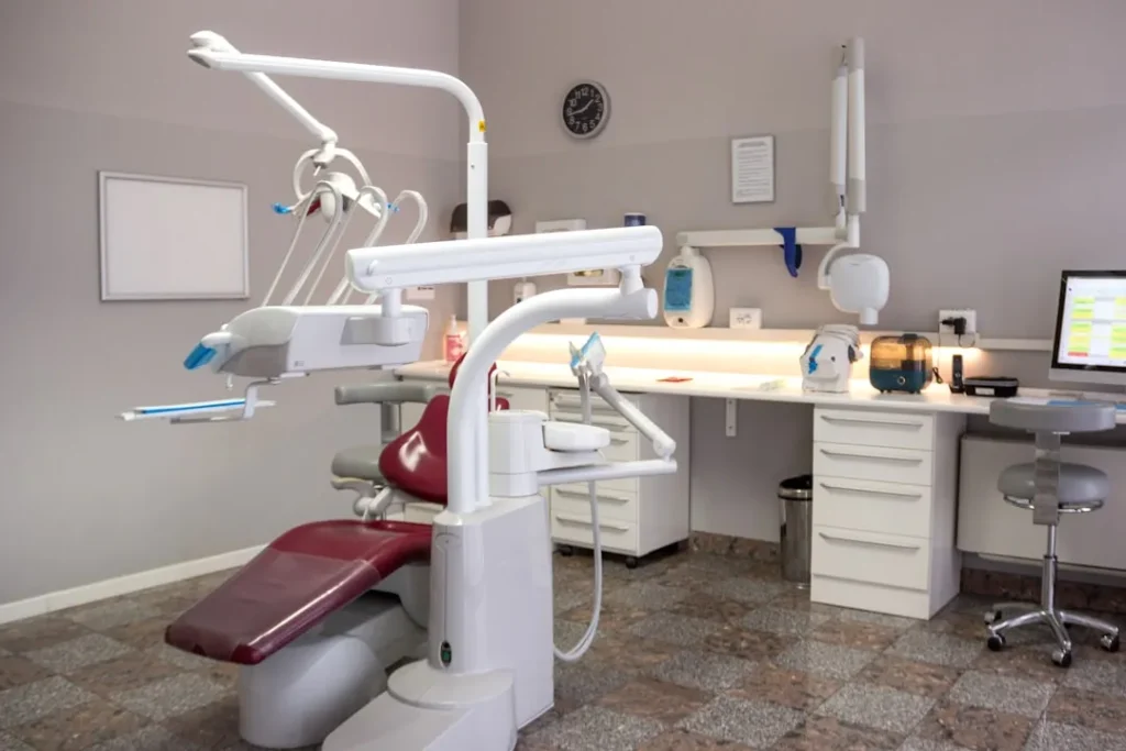 A dental room with a desk and chair