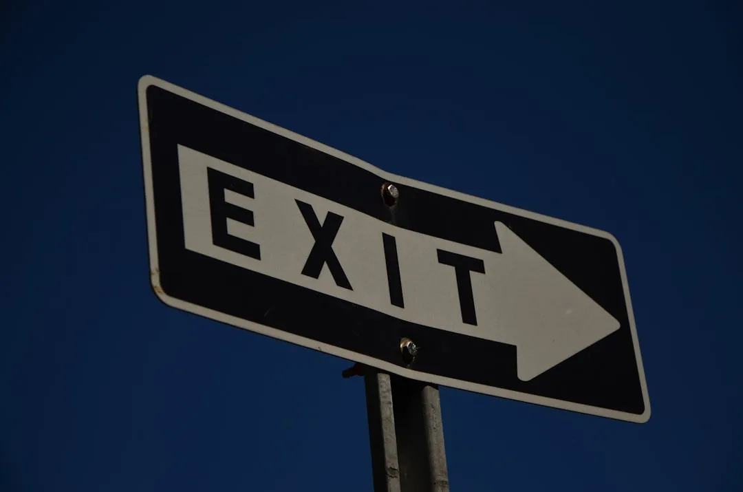The exit sign points towards the right direction.