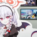 A woman with white hair and red eyes is standing in front of a wall with