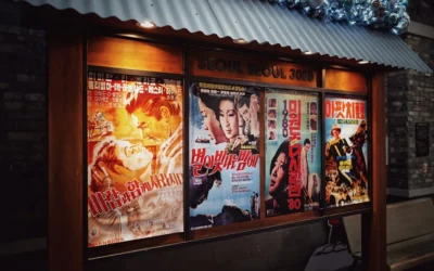 four movie posters on wall