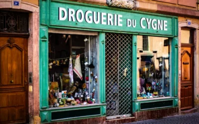 Old storefront with green facade and signage